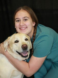 Buffalo Grove Nurse hugging dog